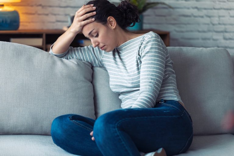A lady is depressed and stressed